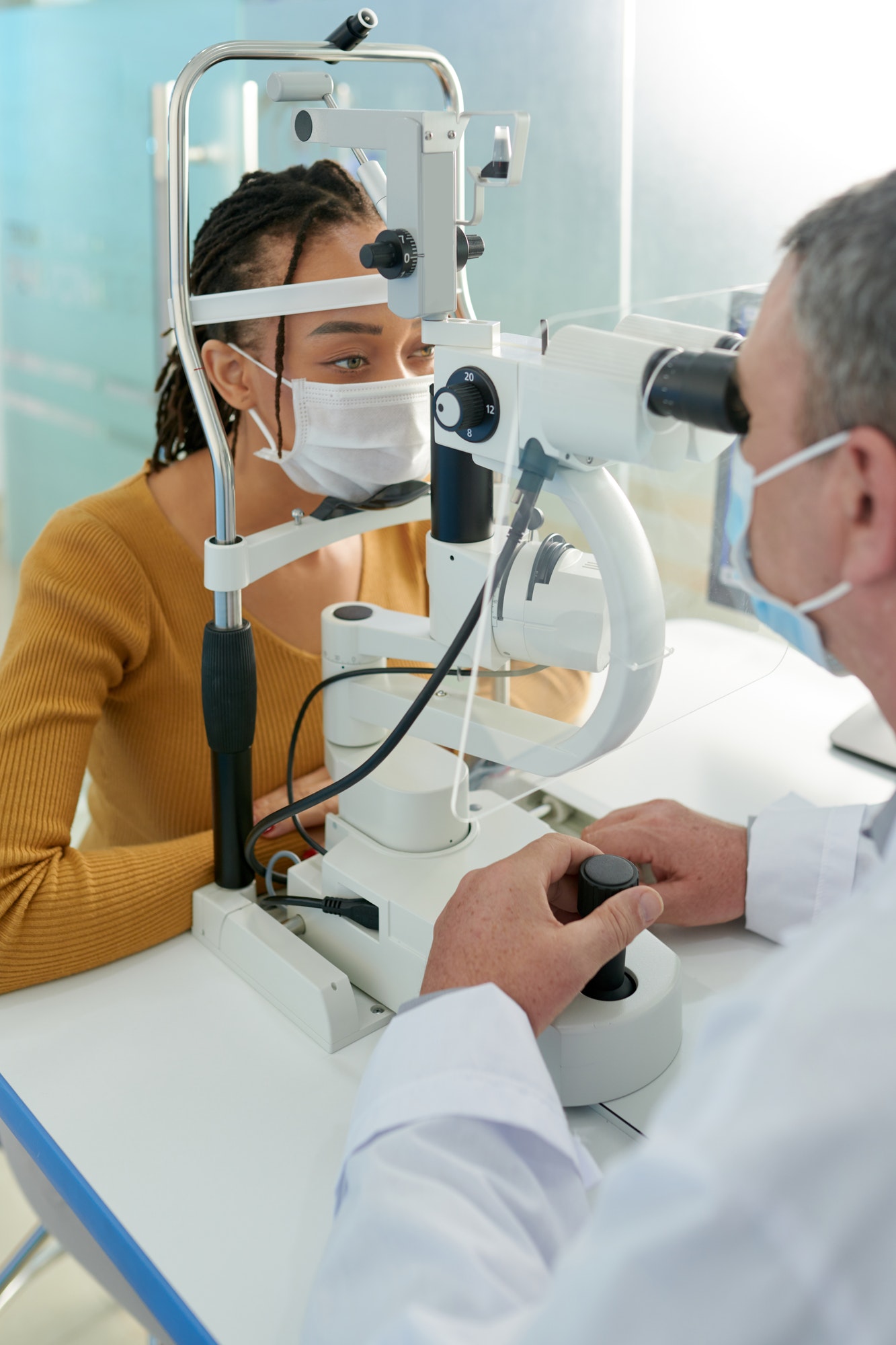 Optometrist Measuring Pressure Within Eyes